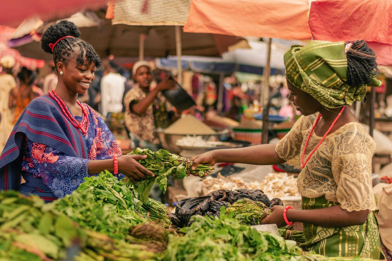 Kenyan market seller serving a customer